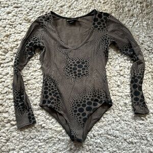 Nooworks bodysuit in classic print. Size medium.